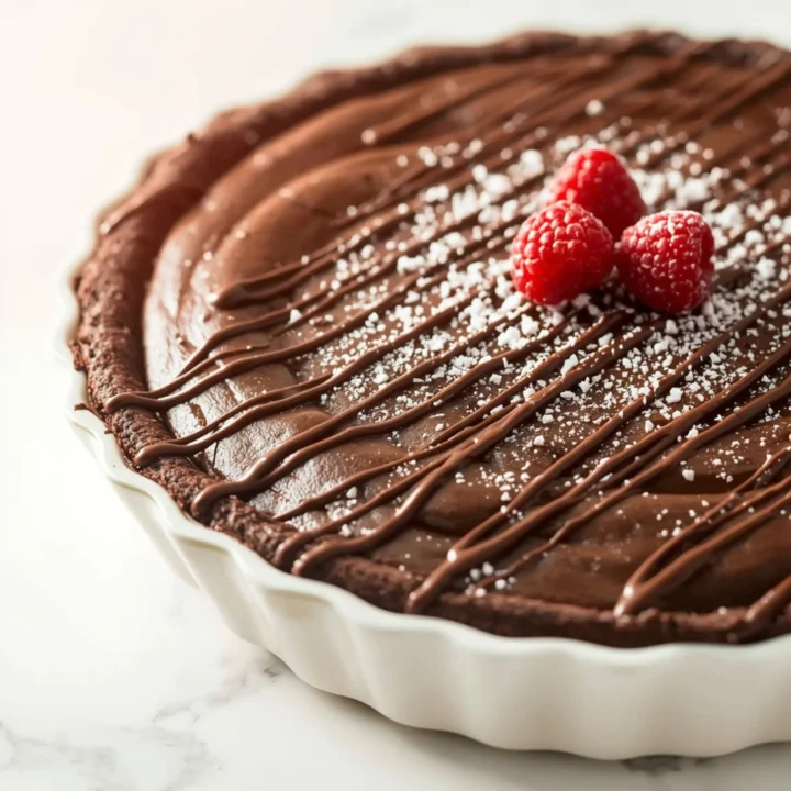 Close-up of Easy Gooey Brownie Pie Recipe dessert with glossy finish and elegant toppings
